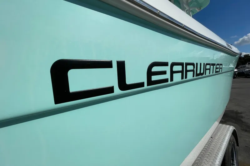 Slide: The Image of Clearwater 2200 boat, 2021 model, light blue hull with bold black lettering. - 11