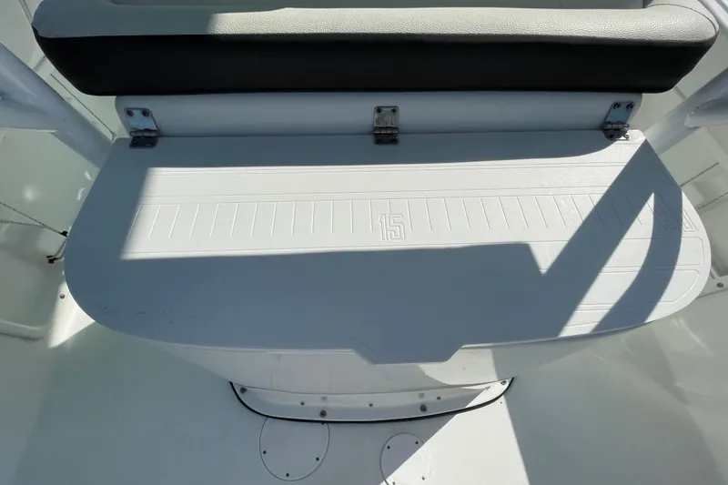Slide: The Image of 2021 Clearwater 2200 boat seat with shadowed deck and measurement markings. - 13