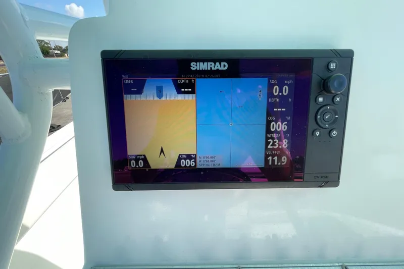 Slide: The Image of Simrad navigation display on 2021 Clearwater 2200 boat, showing speed and course data. - 19