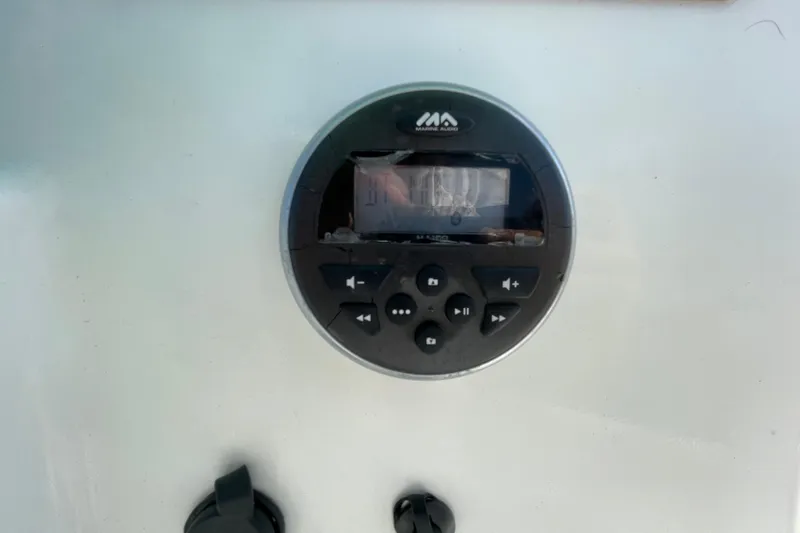 Slide: The Image of Marine audio control panel on a 2021 Clearwater 2200 boat dashboard. - 20