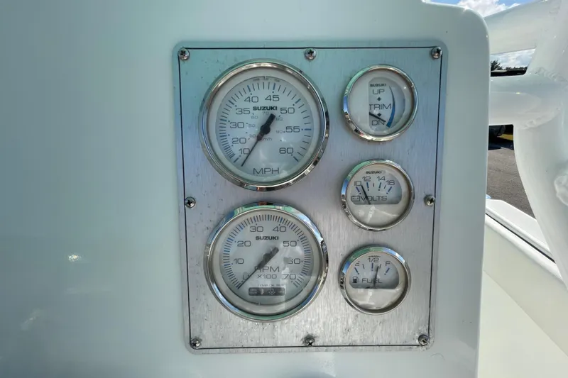 Slide: The Image of Dashboard of a 2021 Clearwater 2200 boat with Suzuki gauges. - 22