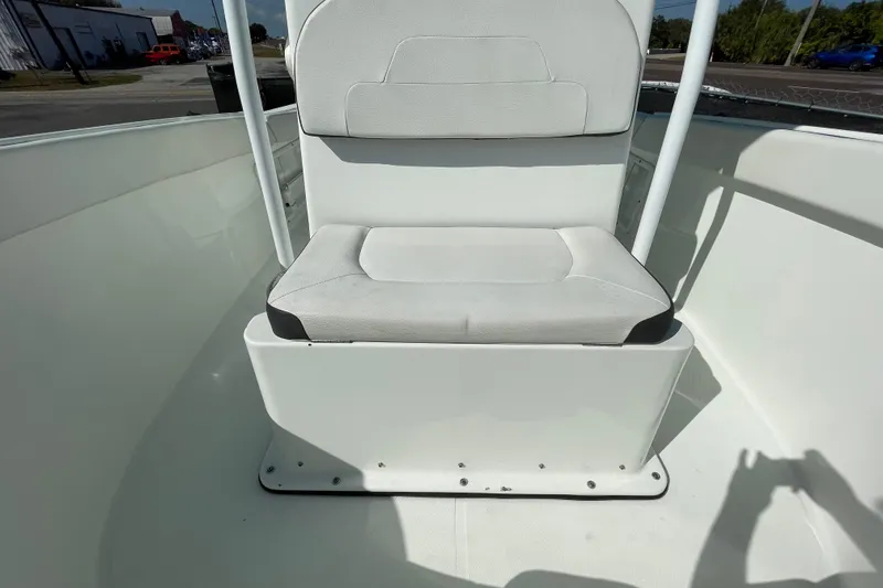 Slide: The Image of 2021 Clearwater 2200 boat interior with white cushioned seating. - 27