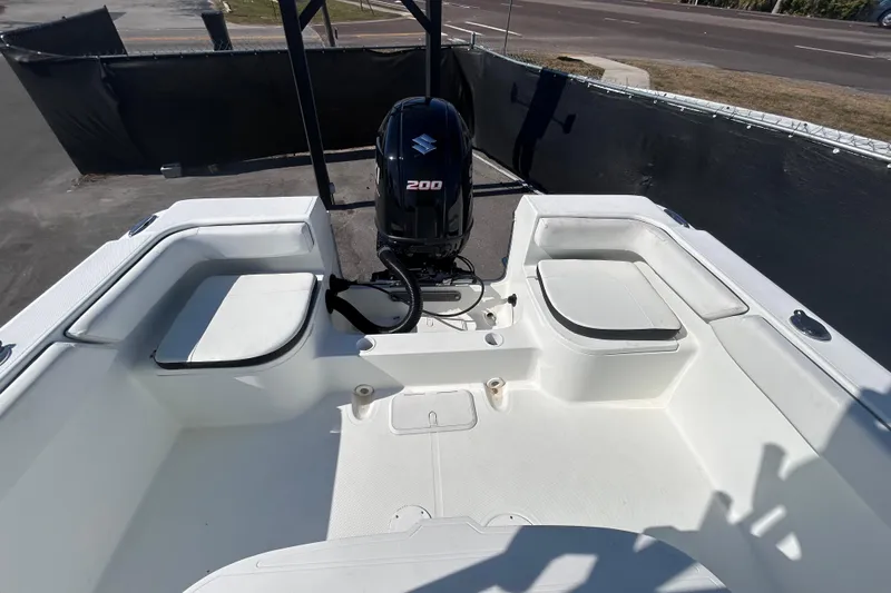 Slide: The Image of 2021 Clearwater 2200 boat interior with Suzuki 200 engine, featuring spacious seating. - 32