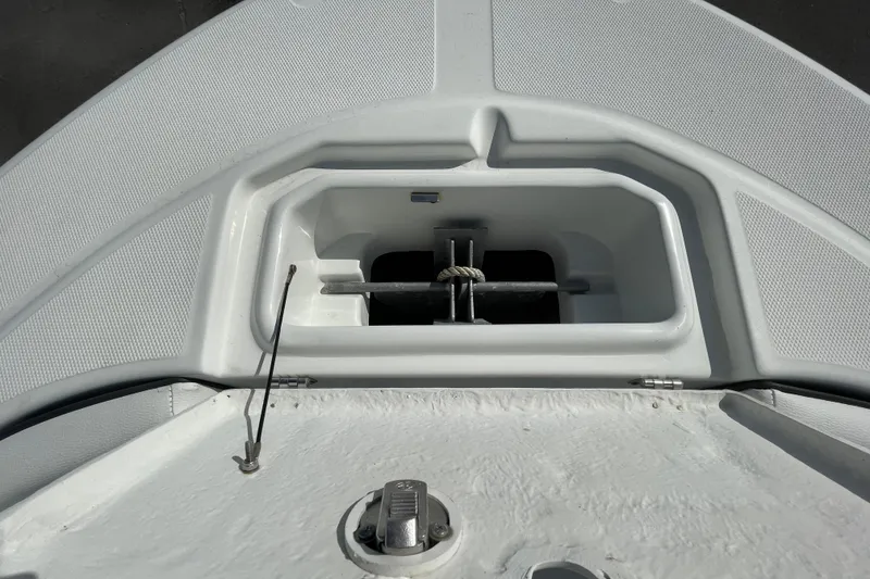 Slide: The Image of Anchor compartment of 2021 Clearwater 2200 boat, featuring a neatly stored anchor. - 34
