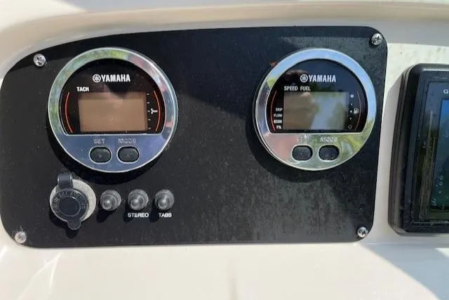 Slide: The Image of Yamaha gauges on 2017 Robalo R207 Dual Console boat dashboard. - 12