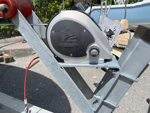 Slide: The Image of Trailer winch mechanism on a 2017 Robalo R207 Dual Console boat trailer. - 16