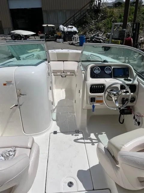 Slide: The Image of 2017 Robalo R207 Dual Console boat interior with steering wheel and seating. - 5