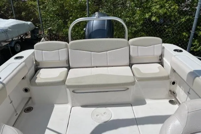 Slide: The Image of 2017 Robalo R207 Dual Console boat interior with cushioned seating and storage. - 6