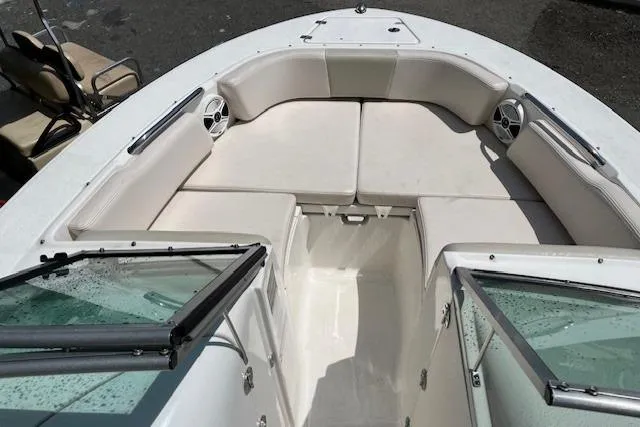 Slide: The Image of 2017 Robalo R207 Dual Console boat with spacious seating and open deck design. - 7