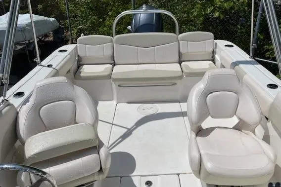 Slide: The Image of 2017 Robalo R207 Dual Console boat interior with white seating and spacious layout. - 8