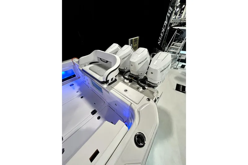 Slide: The Image of 2026 Blackfin 400 CC boat with triple Mercury engines and sleek white seating. - 13