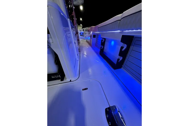 Slide: The Image of 2026 Blackfin 400 CC boat interior with blue LED lighting. - 15