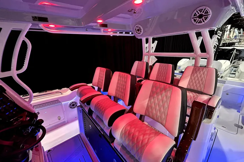 Slide: The Image of 2026 Blackfin 400 CC boat interior with luxurious seating and ambient lighting. - 20