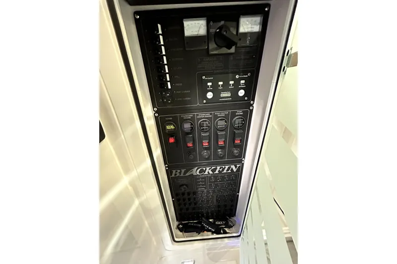 Slide: The Image of 2026 Blackfin 400 CC control panel with switches and indicators. - 21