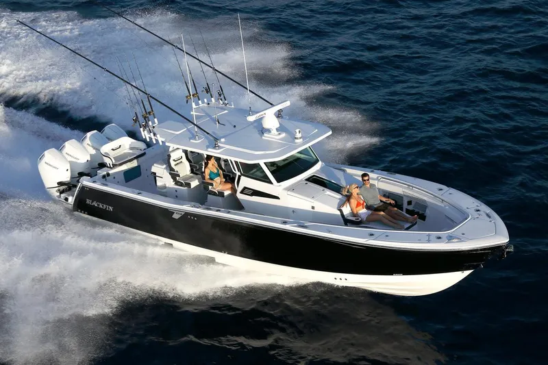 Slide: The Image of Manufacturer Provided Image: 2026 Blackfin 400 CC boat cruising on open water with passengers enjoying the ride. - 5