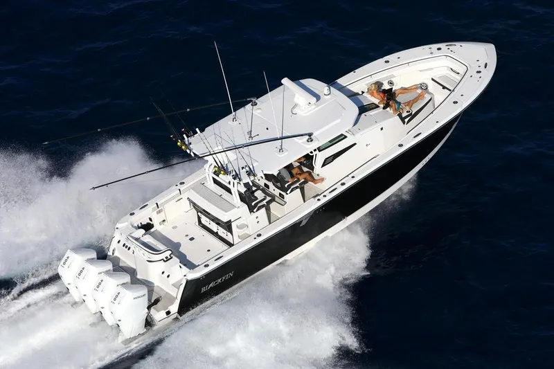 Slide: The Image of Manufacturer Provided Image: 2026 Blackfin 400 CC boat cruising on open water with passengers onboard. - 7