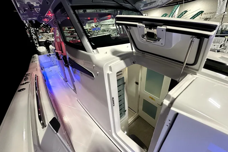 Slide: The Image of 2026 Blackfin 400 CC boat interior with open hatch and modern design. - 9