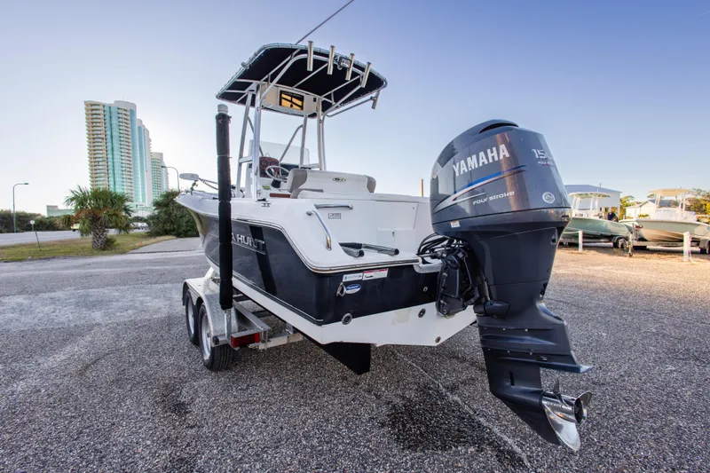 Slide: The Image of 2010 Sea Hunt Ultra 210 boat with Yamaha 150 engine on trailer, urban backdrop. - 13