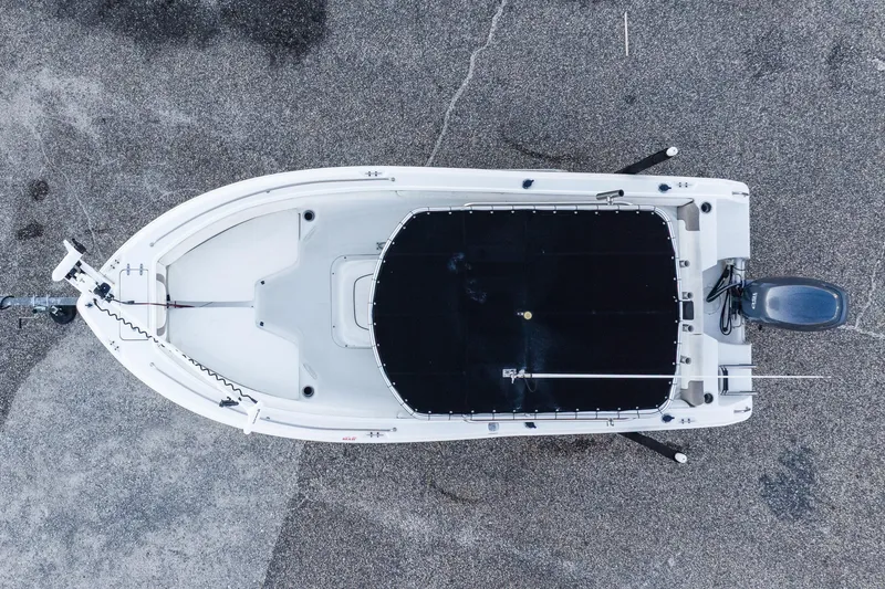 Slide: The Image of Overhead view of 2010 Sea Hunt Ultra 210 boat on pavement. - 14