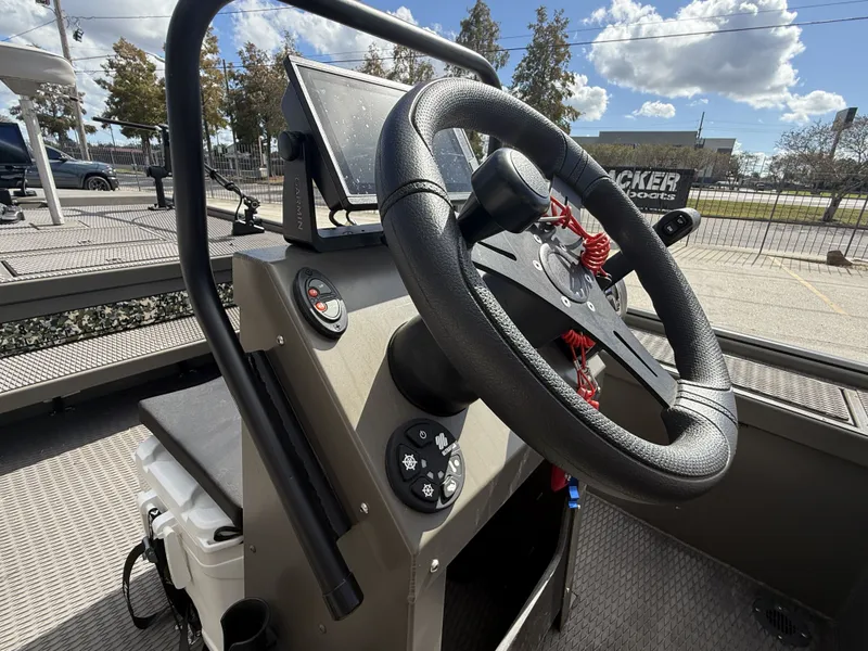 Slide: The Image of 2022 Gator Tail Extreme Series 1860CC boat console with steering wheel and Garmin display. - 12