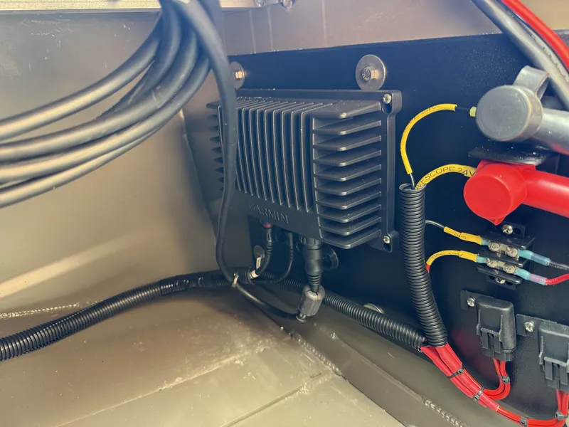 Slide: The Image of Electrical wiring and components inside a 2022 Gator Tail Extreme Series 1860CC boat. - 13