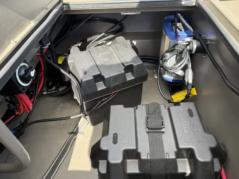 Slide: The Image of 2022 Gator Tail Extreme Series 1860CC boat battery compartment with wiring and components. - 14