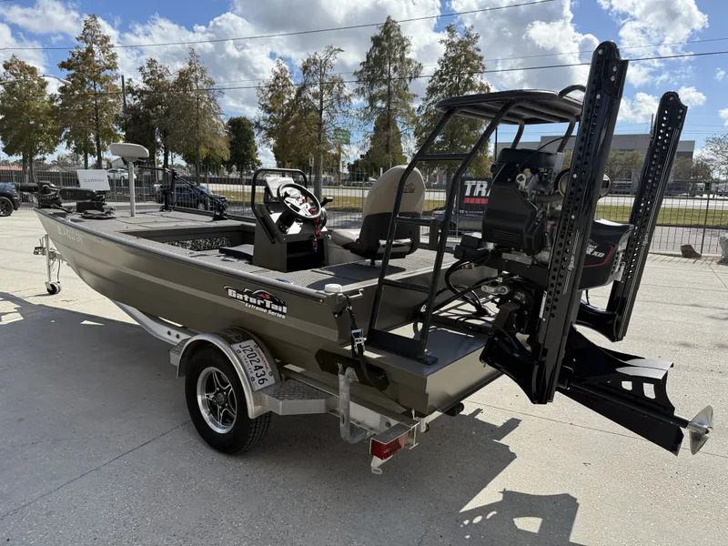 Slide: The Image of 2022 Gator Tail Extreme Series 1860CC boat on trailer, outdoors under blue sky. - 16