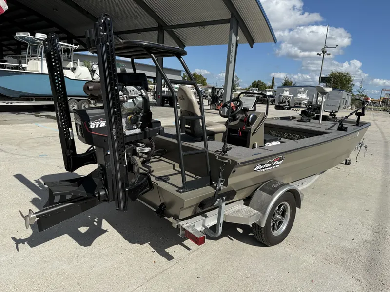 Slide: The Image of 2022 Gator Tail Extreme Series 1860CC boat on trailer, parked under a canopy. - 18