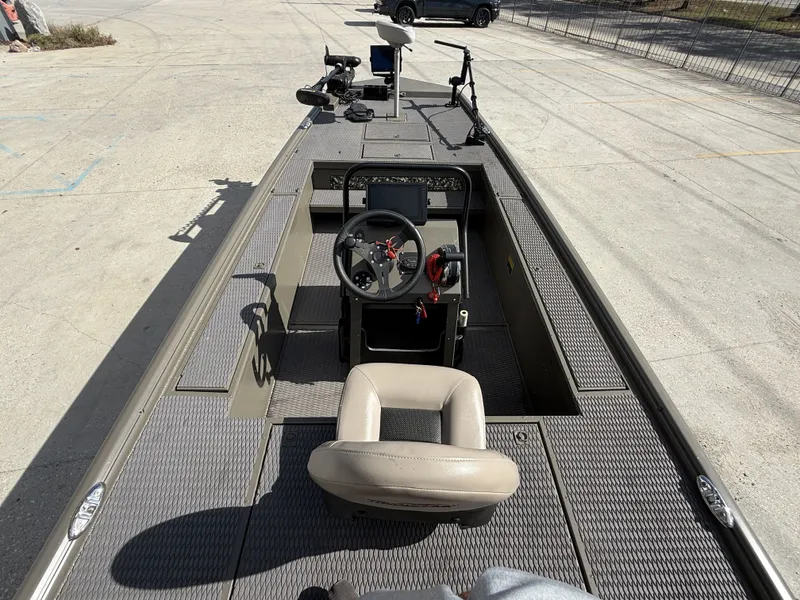 Slide: The Image of 2022 Gator Tail Extreme Series 1860CC boat interior with steering console and seating. - 19