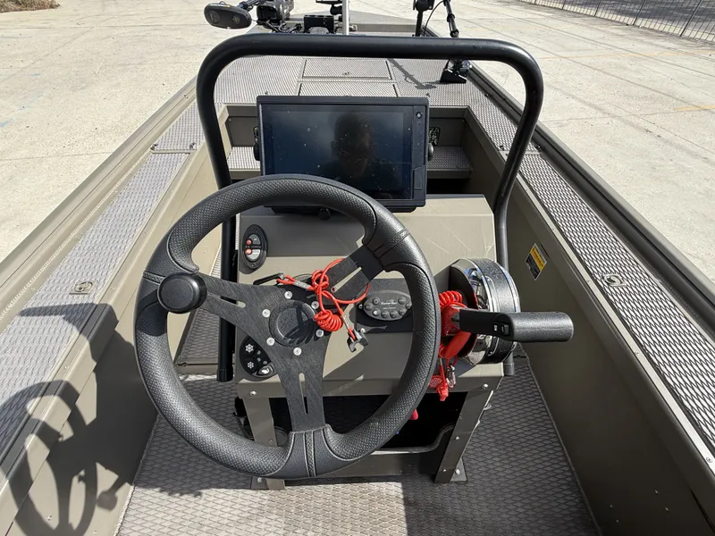 Slide: The Image of 2022 Gator Tail Extreme Series 1860CC boat console with steering wheel and control panel. - 20
