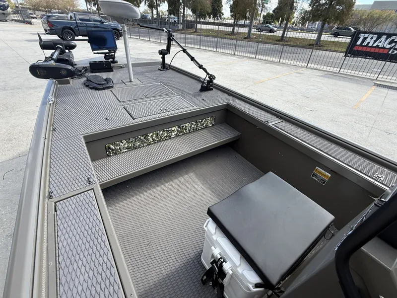 Slide: The Image of 2022 Gator Tail Extreme Series 1860CC boat interior with fishing equipment and seating. - 4