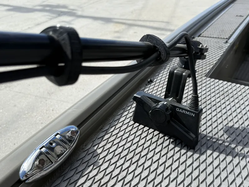 Slide: The Image of 2022 Gator Tail Extreme Series 1860CC boat with Garmin device on textured surface. - 9