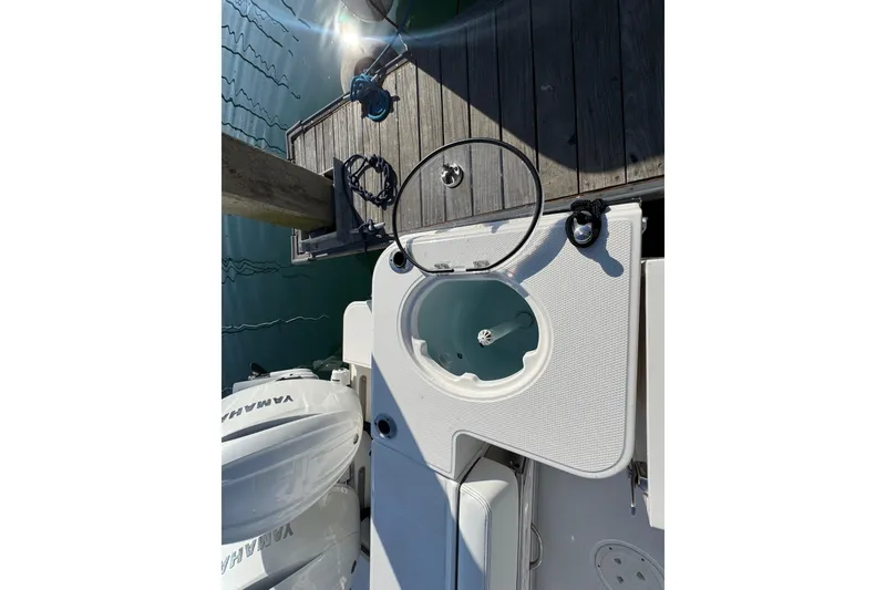 Slide: The Image of 2025 Robalo R270 Center Console boat with Yamaha engines at dockside. - 13