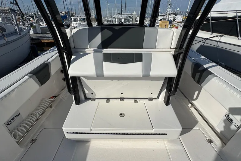 Slide: The Image of 2025 Robalo R270 Center Console boat interior with seating and storage. - 25