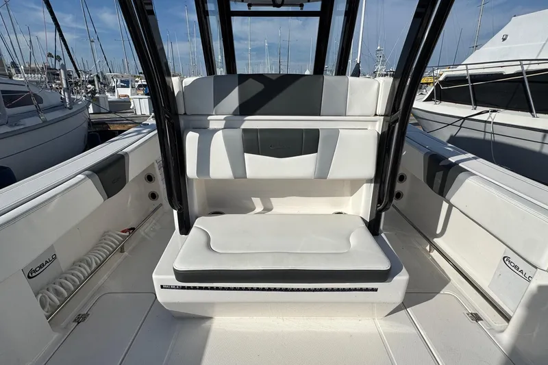 Slide: The Image of 2025 Robalo R270 Center Console boat interior with seating and storage. - 26