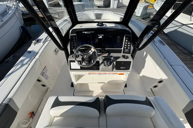 Slide: The Image of 2025 Robalo R270 Center Console boat interior with modern helm and seating. - 29