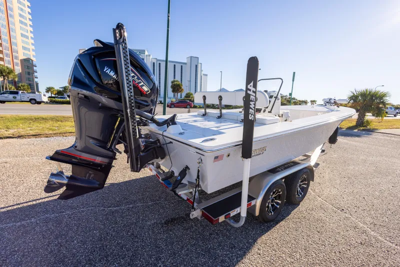 Slide: The Image of 2023 Hewes Redfisher 21 boat with Yamaha engine on trailer, parked outdoors. - 10
