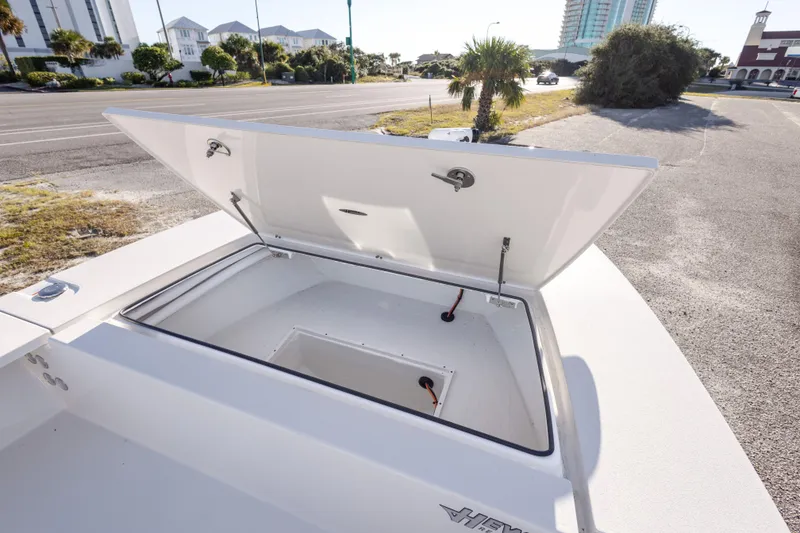 Slide: The Image of 2023 Hewes Redfisher 21 boat storage compartment open, showcasing spacious interior. - 20