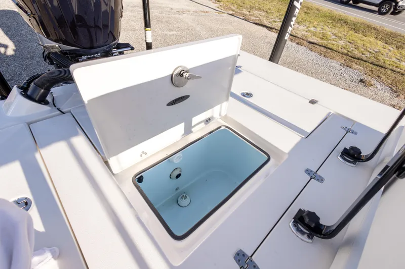 Slide: The Image of 2023 Hewes Redfisher 21 boat with open storage compartment, showcasing interior design. - 24