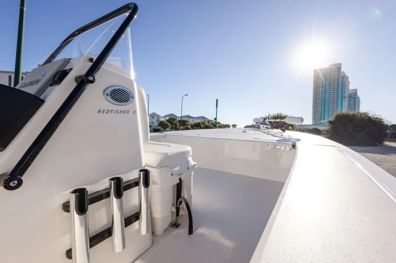Slide: The Image of 2023 Hewes Redfisher 21 boat in sunny urban setting with modern buildings. - 25