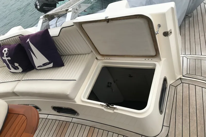 Slide: The Image of Open hatch on 1996 Princess boat with nautical-themed cushions on deck. - 17