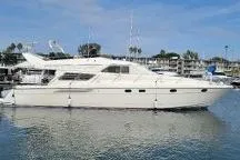 Slide: The Image of Luxury 1996 Princess yacht docked in a serene marina setting. - 2