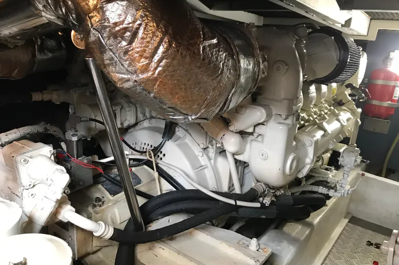 Slide: The Image of Engine room of a 1996 Princess model yacht, showcasing machinery and components. - 27