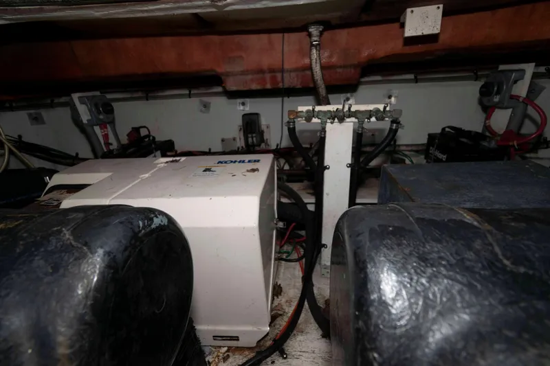 Slide: The Image of Engine room of 1999 Cruisers Yachts 3575 Express with Kohler generator. - 17