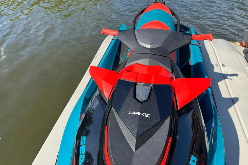 Slide: The Image of 2019 Sea-Doo Wake 155 jet ski docked on water, top view. - 7