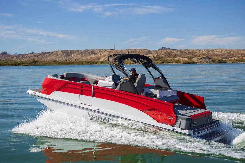 Slide: The Image of 2024 Paradigm Damascus 296 Surf boat cruising on a serene lake. - 14