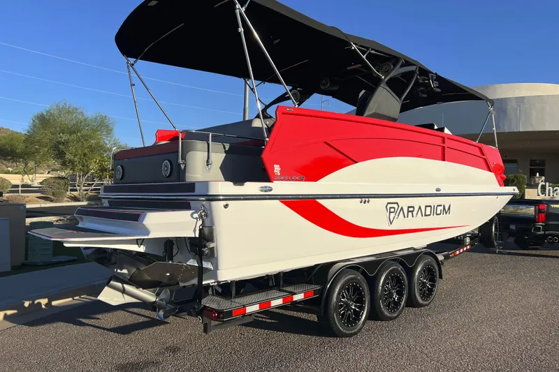 Slide: The Image of 2024 Paradigm Damascus 296 Surf boat on trailer, featuring sleek red and white design. - 7