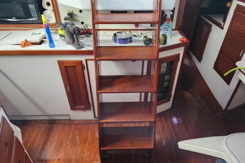 Slide: The Image of Interior of 1990 Catalina/Morgan 44 Center Cockpit with wooden ladder and equipment. - 11