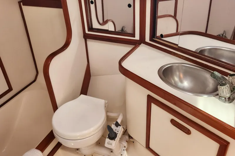 Slide: The Image of Bathroom interior of 1990 Morgan 44 Center Cockpit yacht with sink and toilet. - 13