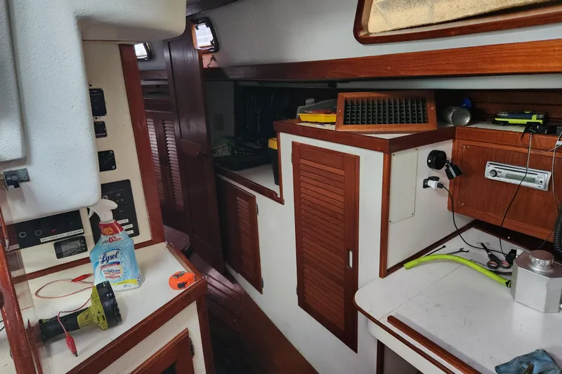Slide: The Image of Interior of a 1990 Catalina/Morgan 44 Center Cockpit sailboat with wooden cabinetry. - 14